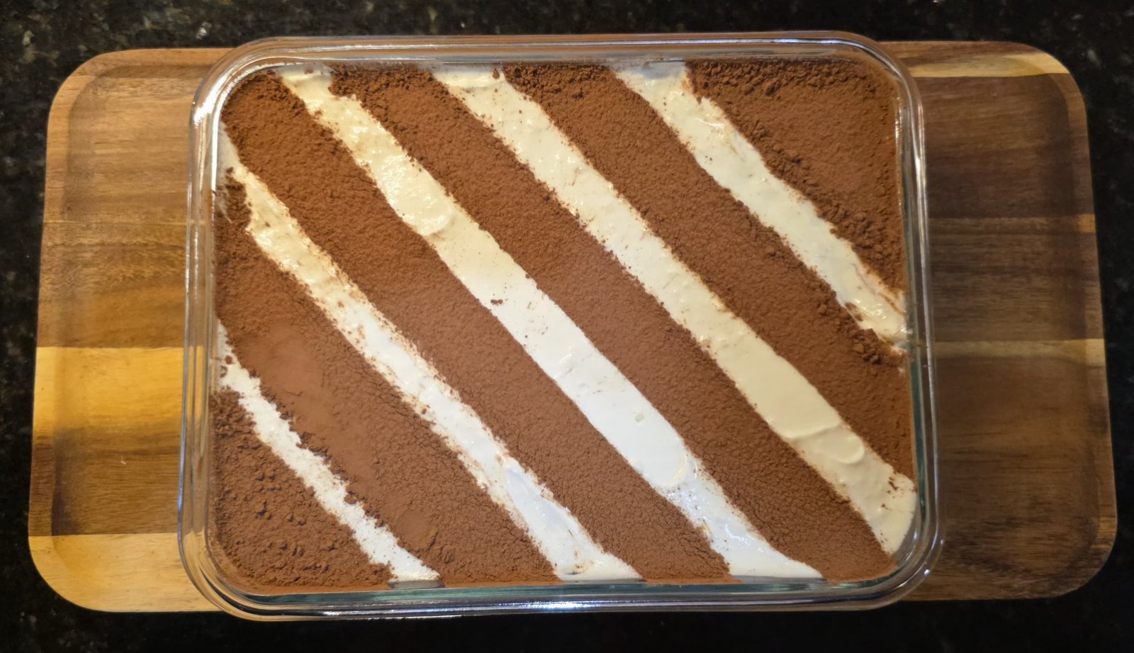 Classic tiramisu tray dusted with cocoa